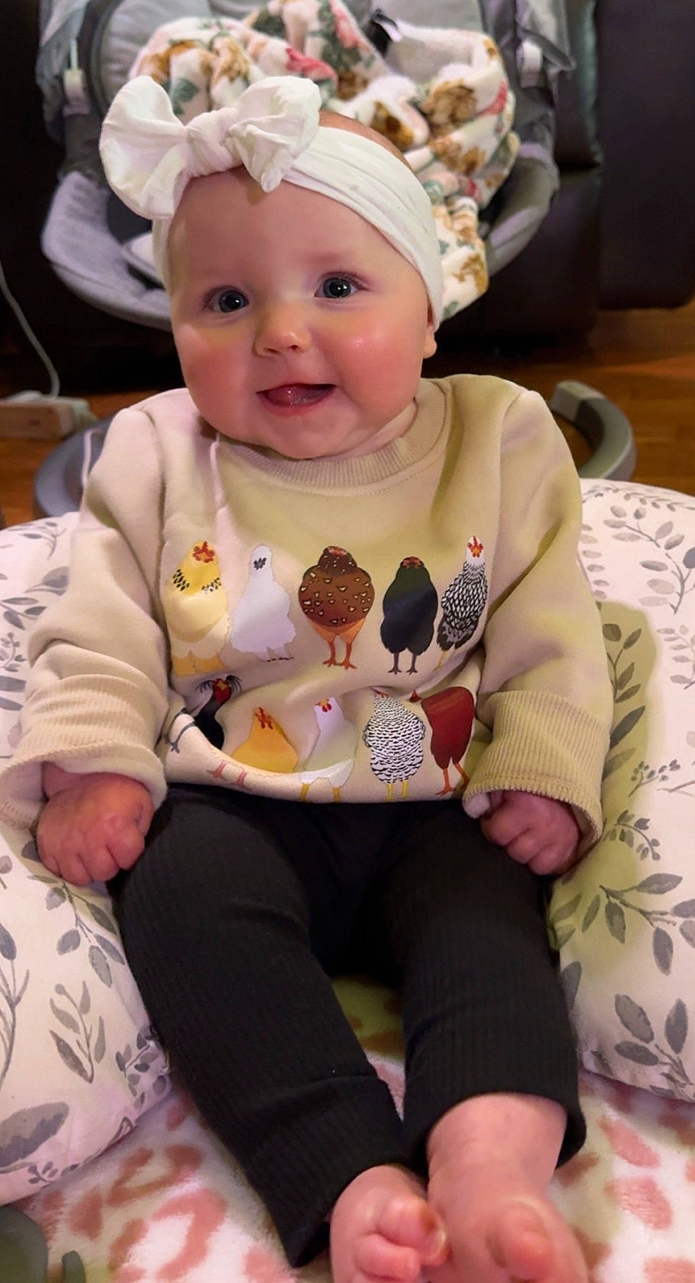 Layla joined the competition — help win amazing prizes! animal, applique, baby, bird, bodypart, bonnet, cap, clothing, couch, face, finger, food, furniture, hand, hat, head, person, photography, portrait, sitting