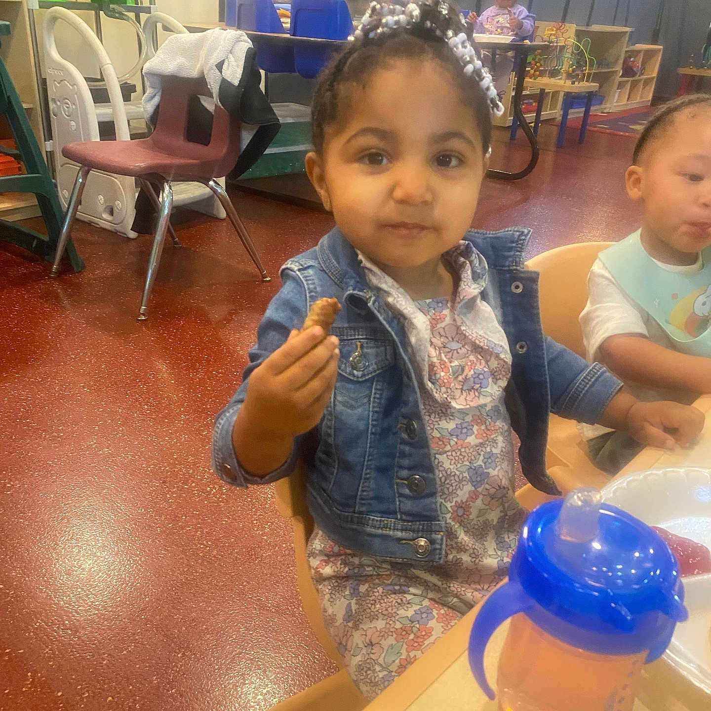 Janet joined the competition — help win amazing prizes! architecture, building, chair, child, cutlery, diningroom, diningtable, face, female, furniture, girl, head, indoors, person, photography, portrait, pottery, room, spoon, table