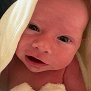 Malakai is registered to the contest to win money with this photo: baby, newborn, infant, face, eyes, skin, towel, soft, closeup, portrait, cute, expression, child, wrapped, blanket, newborn_baby, human, mouth, head, indoors