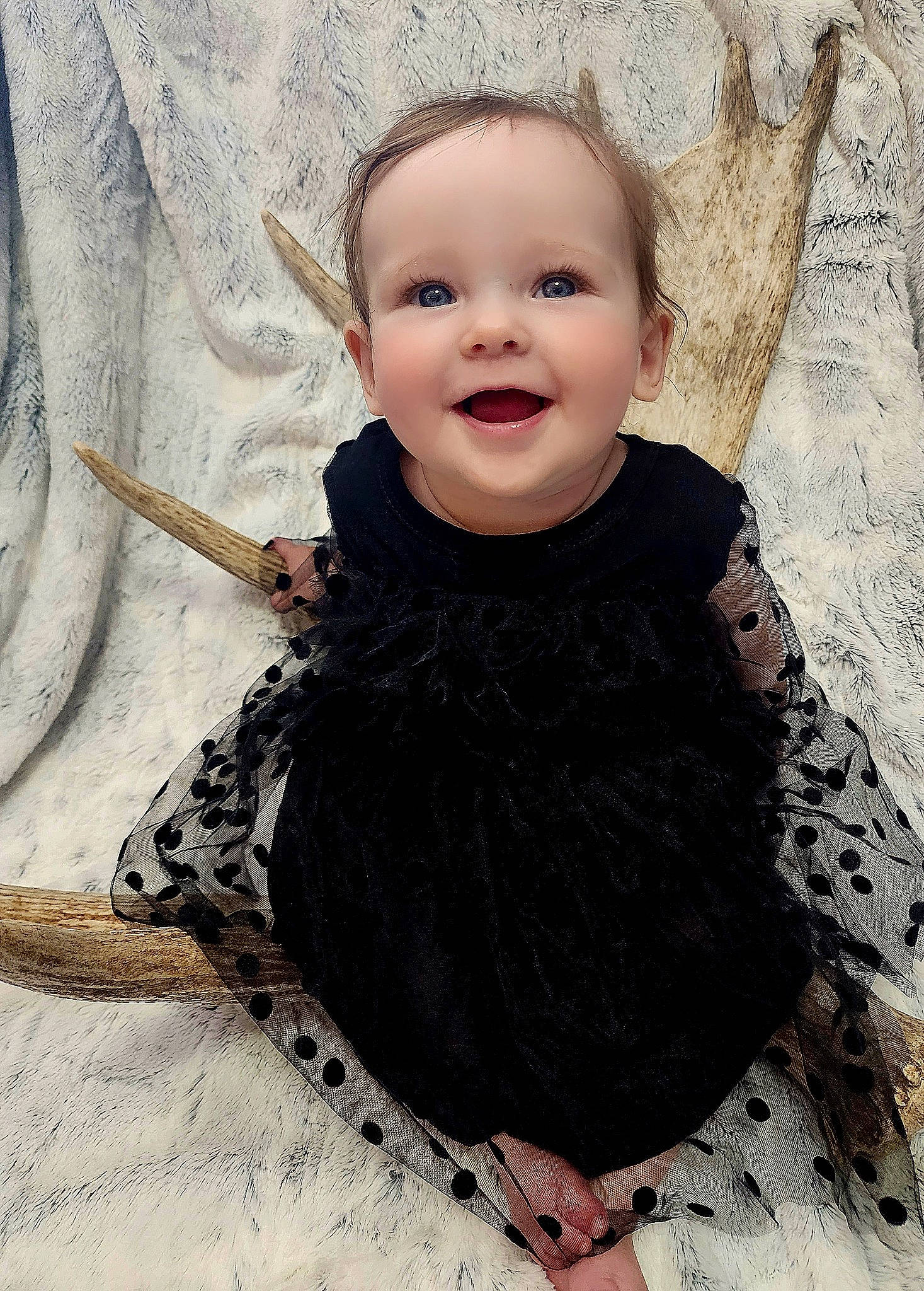 Mackenna is registered to the contest to win money with this photo: art, baby, baby_toddler_clothing, cheek, eye, face, flash_photography, gesture, happy, head, headgear, human_body, iris, joy, outerwear, pattern, person, skin, sleeve, smile