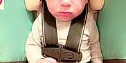 Weston joined the competition — help win amazing prizes! baby, car_seat, child, infant, straps, serious_expression, face, head_support, clothing, legs, feet, hands, indoor, seatbelt, safety, person, cute, young, closeup, portrait