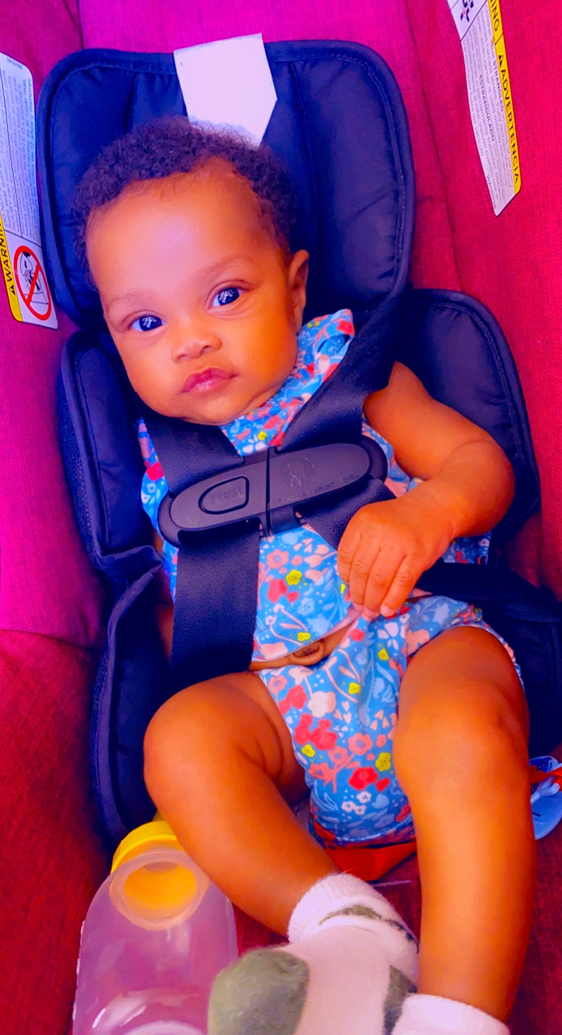 Kaleigh is registered to the contest to win money with this photo: azure, baby, baby_toddler_clothing, blue, car_seat, comfort, electric_blue, eye, finger, fun, happy, head, human_body, magenta, orange, person, pink, purple, skin, thigh
