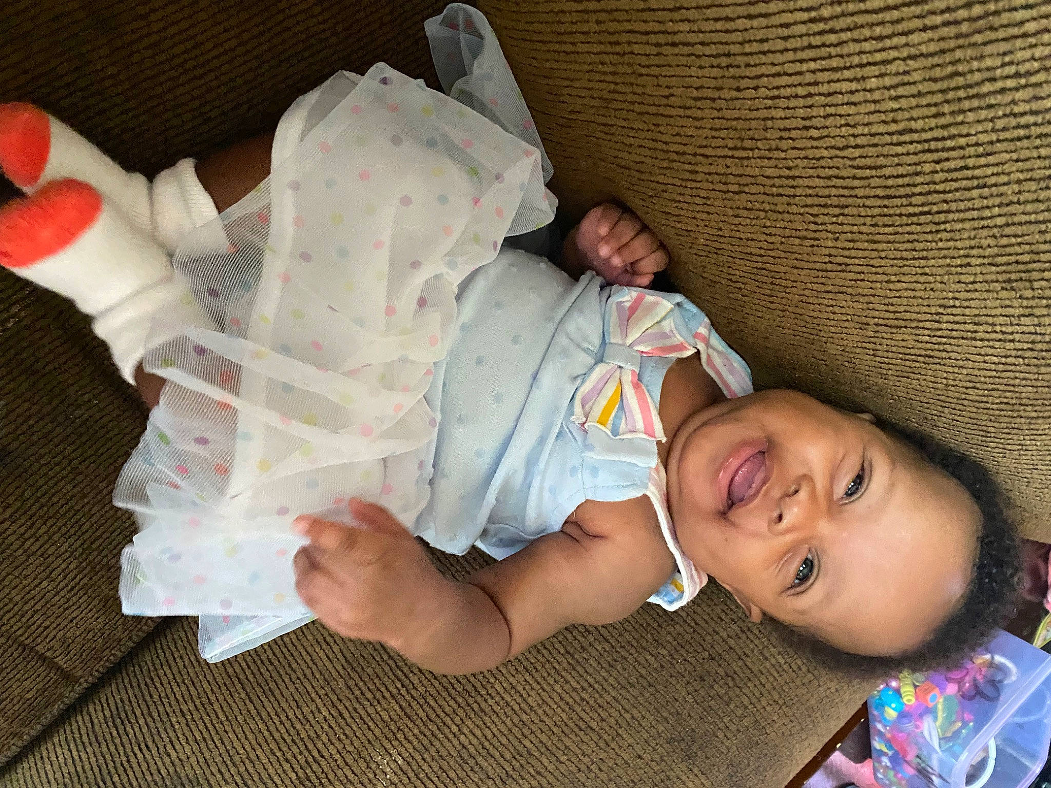 Kaleigh is registered to the contest to win money with this photo: baby, baby_products, baby_toddler_clothing, bedtime, child, comfort, couch, finger, fun, happy, human_leg, leg, linens, nap, person, room, sleep, smile, thigh, thumb