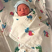 Jacob joined the competition — help win amazing prizes! newborn, baby, infant, child, face, portrait, hospital, hospital_bed, swaddled, blanket, hat, sleeping, awake, eyes, nose, mouth, textile, colorful, indoors, maternity