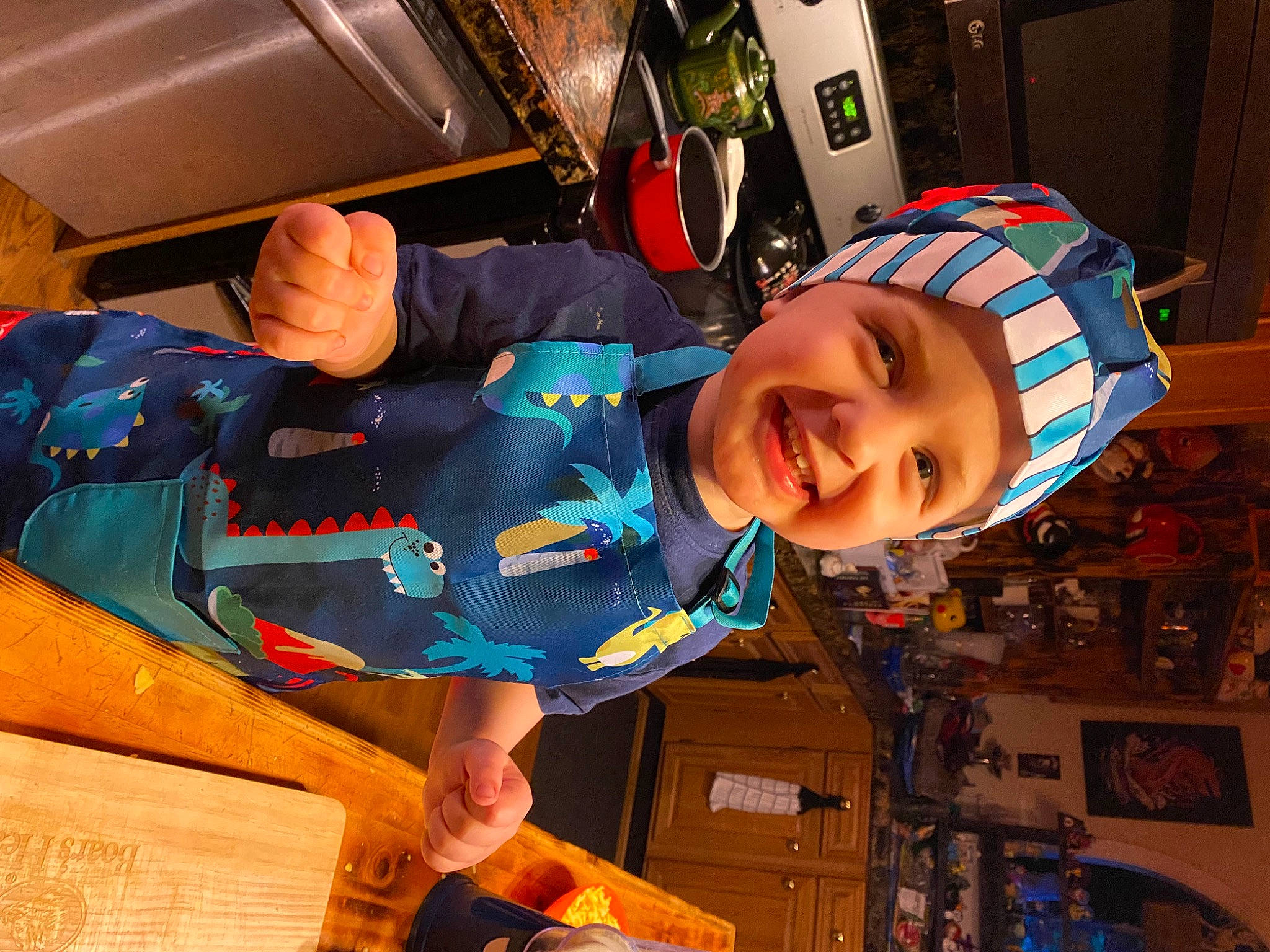 Harlan is registered to the contest to win money with this photo: child, electric_blue, fun, happy, hat, headwear, joy, person, personal_protective_equipment, room, service, smile, t_shirt, toddler