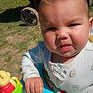 Jackson joined the competition — help win amazing prizes! baby, child, walker, outdoor, sunlight, grass, stroller, toy, colorful, person, infant, cute, face, expression, clothing, play, young, daylight, hand, summer