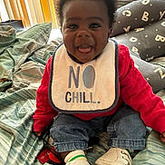 Elleior joined the competition — help win amazing prizes! baby, bed, bib, blanket, child, clothing, cute, denim_pants, footwear, happy, home, indoor, infant, person, pillow, portrait, red_sweater, sitting, smiling, socks