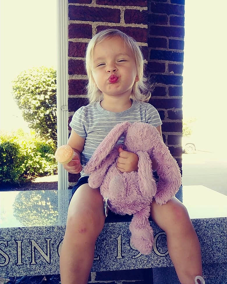 Skyla is registered to the contest to win money with this photo: arm, beauty, cheek, child, dress, face, hand, head, leg, people, person, photograph, photography, pink, purple, shoulder, sitting, skin, snapshot, toddler