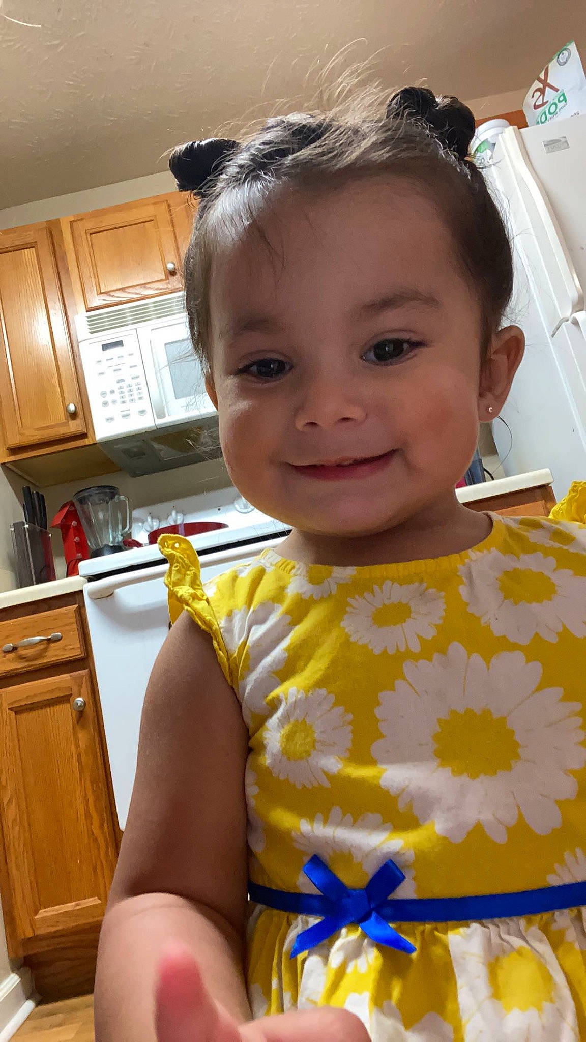 Anais is registered to the contest to win money with this photo: arm, cabinetry, cheek, chin, countertop, face, facial_expression, fun, hair, happy, head, human_body, iris, joy, neck, nose, person, shoulder, skin, smile