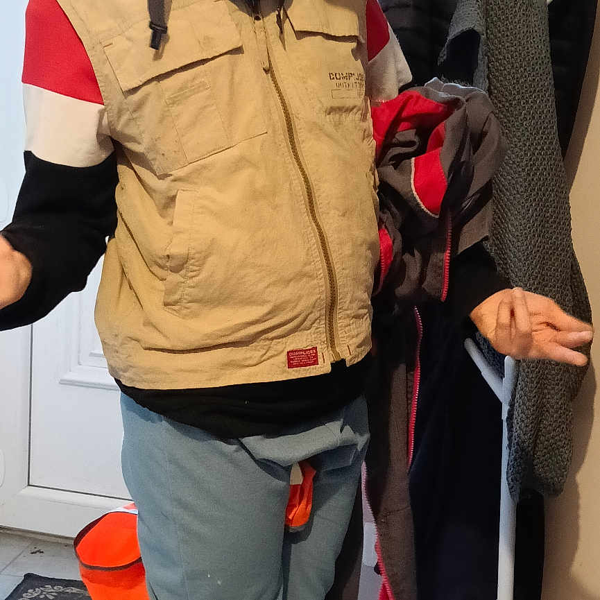 Mathis joined the competition — help win amazing prizes! boots, child, coat_rack, door, entrance_mat, hallway, helmet, indoor, jacket, kid, mat, pants, playful, protective_gear, rubber_boots, safety_goggles, shoes, silly_face, standing, vest