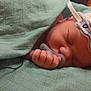Jules participe au concours pour gagner de l'argent avec cette photo : baby, newborn, pacifier, blanket, hat, monitoring_sticker, wires, sleeping, hand, hospital, swaddle, sensor, cap, infant, cheek, nose, finger, textile, closeup, peaceful