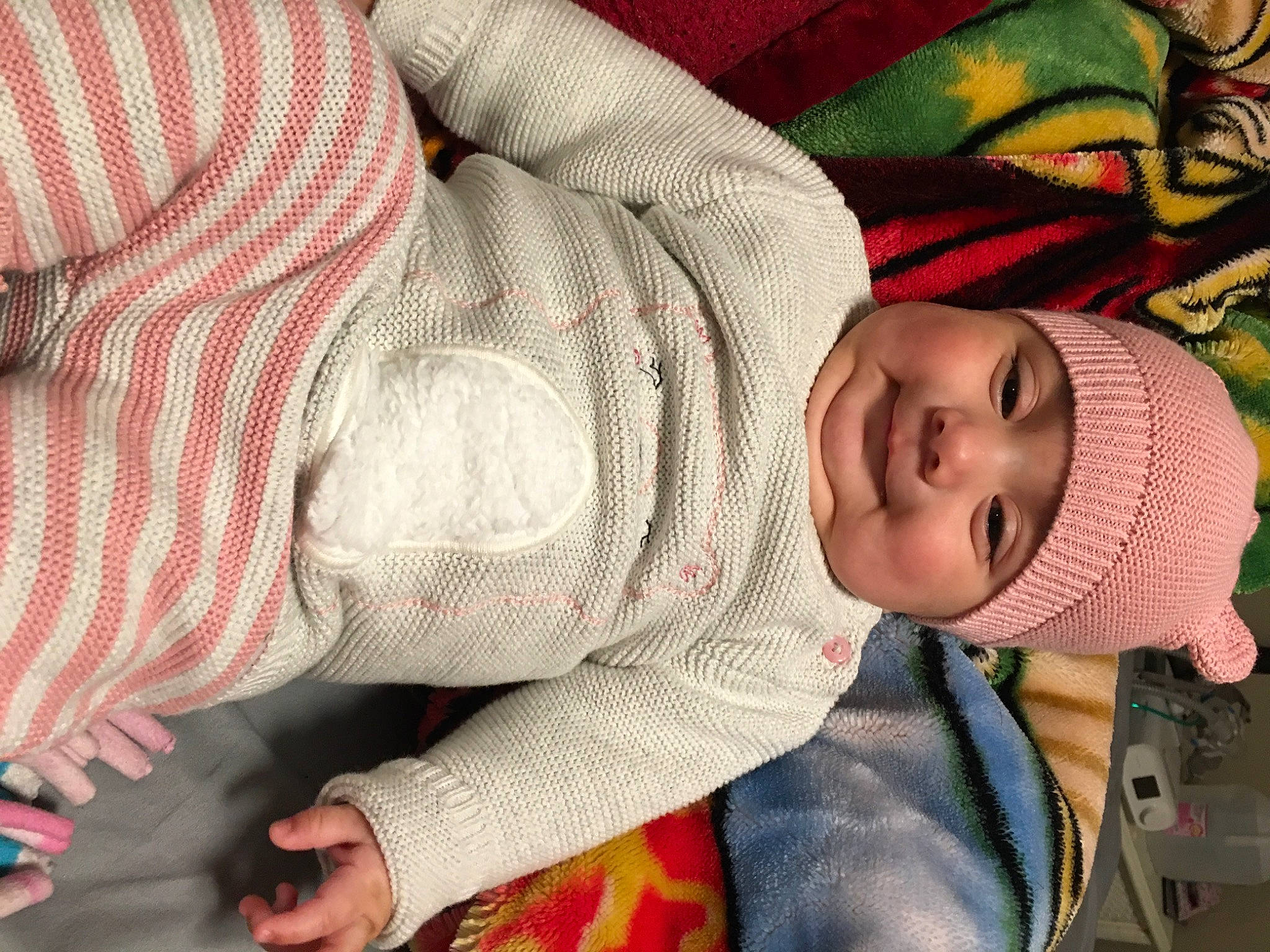 Charlie is registered to the contest to win money with this photo: baby, baby_toddler_clothing, beanie, bonnet, cheek, comfort, headwear, joy, knit_cap, knitting, nap, nose, pattern, person, plaid, sweater, textile, toddler, wool, woolen