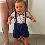 Jules a rejoint le concours — aidez-le/la à gagner de superbes lots ! adult, baby, child, clothing, cute, floor, floral_shirt, hands, indoor, legs, person, sandals, shoes, standing, support, suspenders, tattoo, tiles, toddler, white_wall