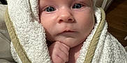 Albie joined the competition — help win amazing prizes! baby, infant, towel, wrapped, face, blue_eyes, skin, hand, indoor, blanket, portrait, cute, child, newborn, soft, expression, person, closeup, cozy, warm