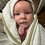 baby, infant, towel, wrapped, face, blue_eyes, skin, hand, indoor, blanket, portrait, cute, child, newborn, soft, expression, person, closeup, cozy, warm