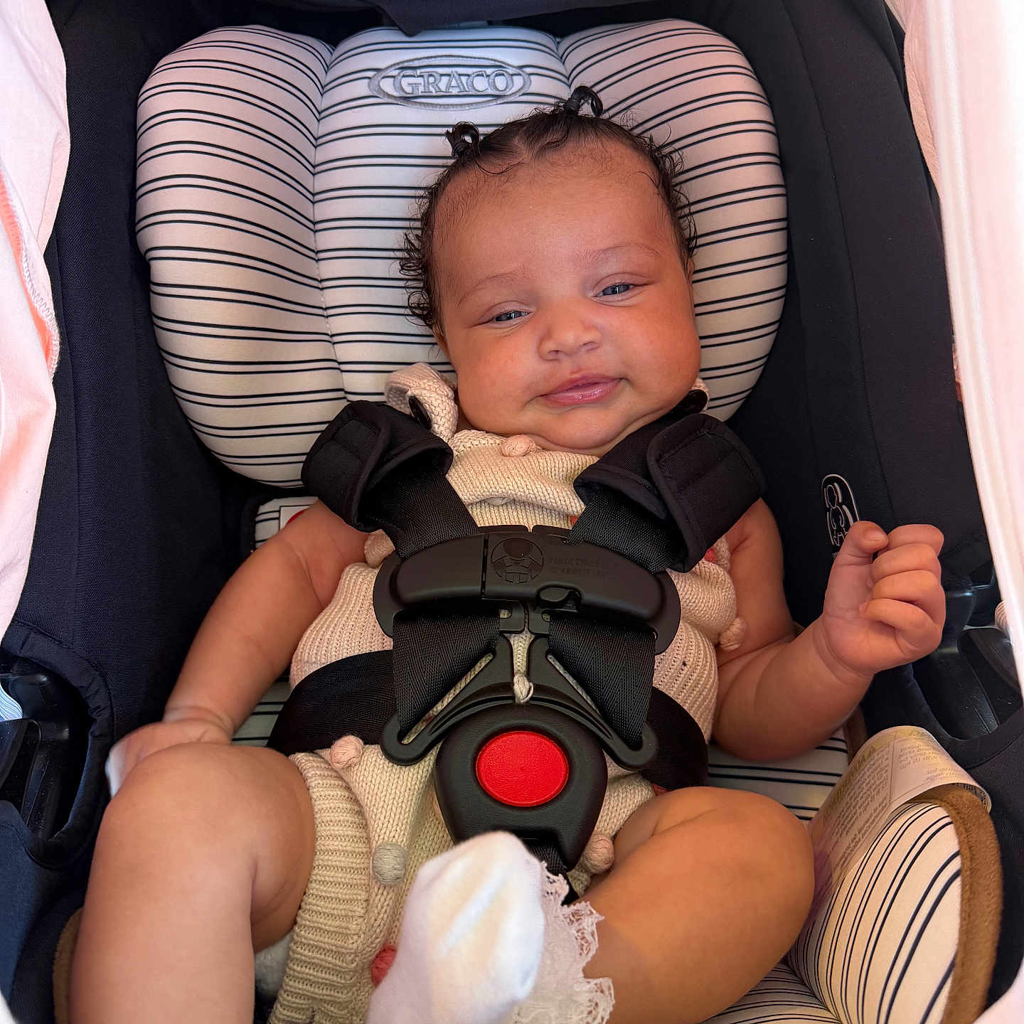 Sarayah joined the competition — help win amazing prizes! baby, car_seat, child, comfort, cute, graco, hands, head, indoor, infant, knitted_clothing, lace, legs, person, portrait, safety_harness, seatbelt, smile, sock, striped