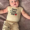 baby, infant, child, clothing, onesie, pants, blanket, face, smiling, cute, adorable, lying_down, soft_texture, red_heart, family, parental_love, sleepwear, toddler, skin, head