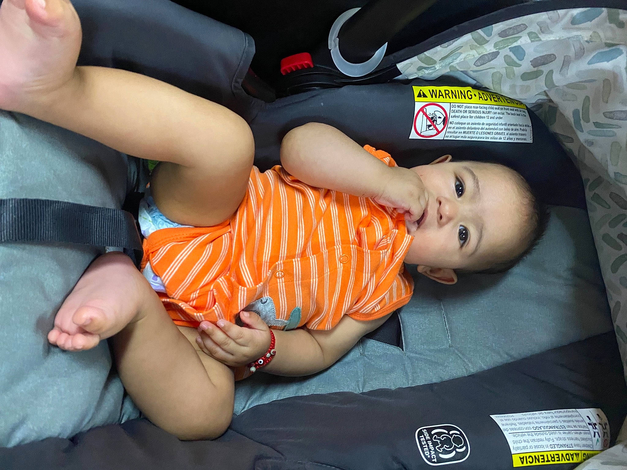 Kyrie is registered to the contest to win money with this photo: abdomen, baby_toddler_clothing, child, comfort, elbow, finger, foot, fun, gesture, hand, human_leg, knee, mouth, nail, person, skin, thigh, thumb, toddler, trunk