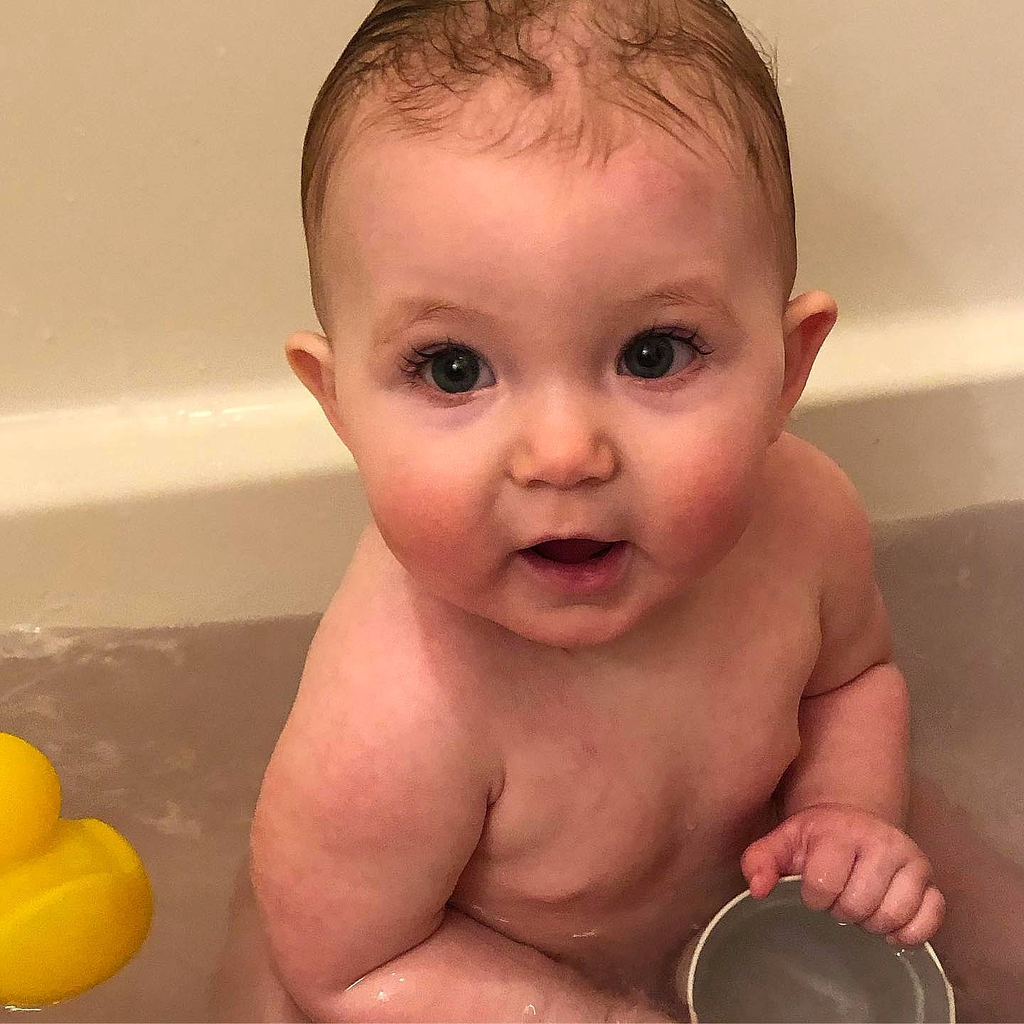 Pamela is registered to the contest to win money with this photo: baby, baby_bathing, baby_making_funny_faces, bathing, bathtub, cheek, child, chin, eye, eyebrow, face, facial_expression, forehead, head, mouth, muscle, nose, person, skin, surprise