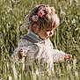 baby, babycrawling, blonde, brownhair, clothing, crawling, dress, face, grass, hair, happy, head, person, photography, plant, portrait, sitting, sleeve