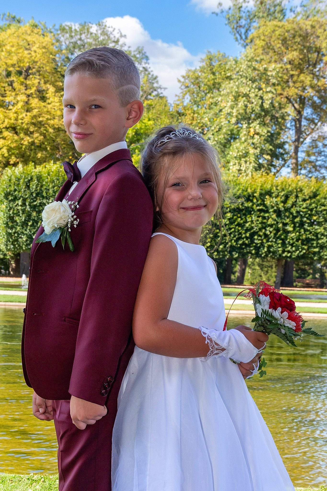 Oriana participe au concours pour gagner de l'argent avec cette photo : bridal_accessory, bridal_clothing, dress, formal_wear, fun, gesture, gown, happy, joy, people_in_nature, person, pink, plant, sky, smile, summer, tie, toddler, tree, water
