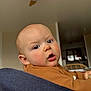 Swann participe au concours pour gagner de l'argent avec cette photo : baby, infant, child, face, eyes, cheeks, open_mouth, drool, ear, bald_head, sweater, brown_sweater, indoor, ceiling_fan, chair, home_interior, candid, portrait, cozy, person