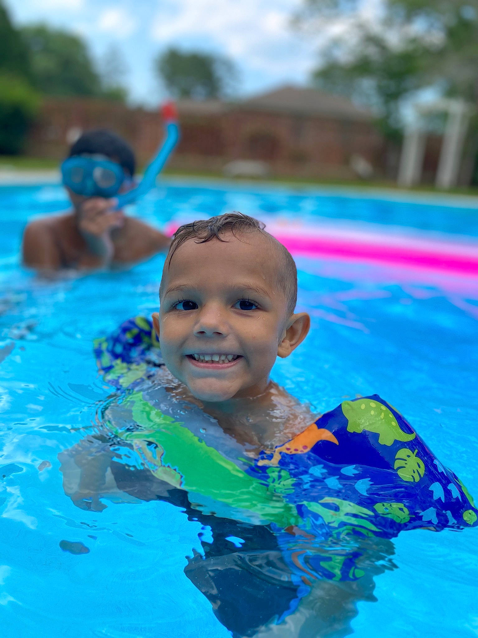 Niko joined the competition — help win amazing prizes! aqua, baby, bathing, child, fun, happy, individual_sports, joy, leisure, leisure_centre, person, personal_protective_equipment, play, recreation, sky, smile, summer, swimmer, swimming_pool, toddler