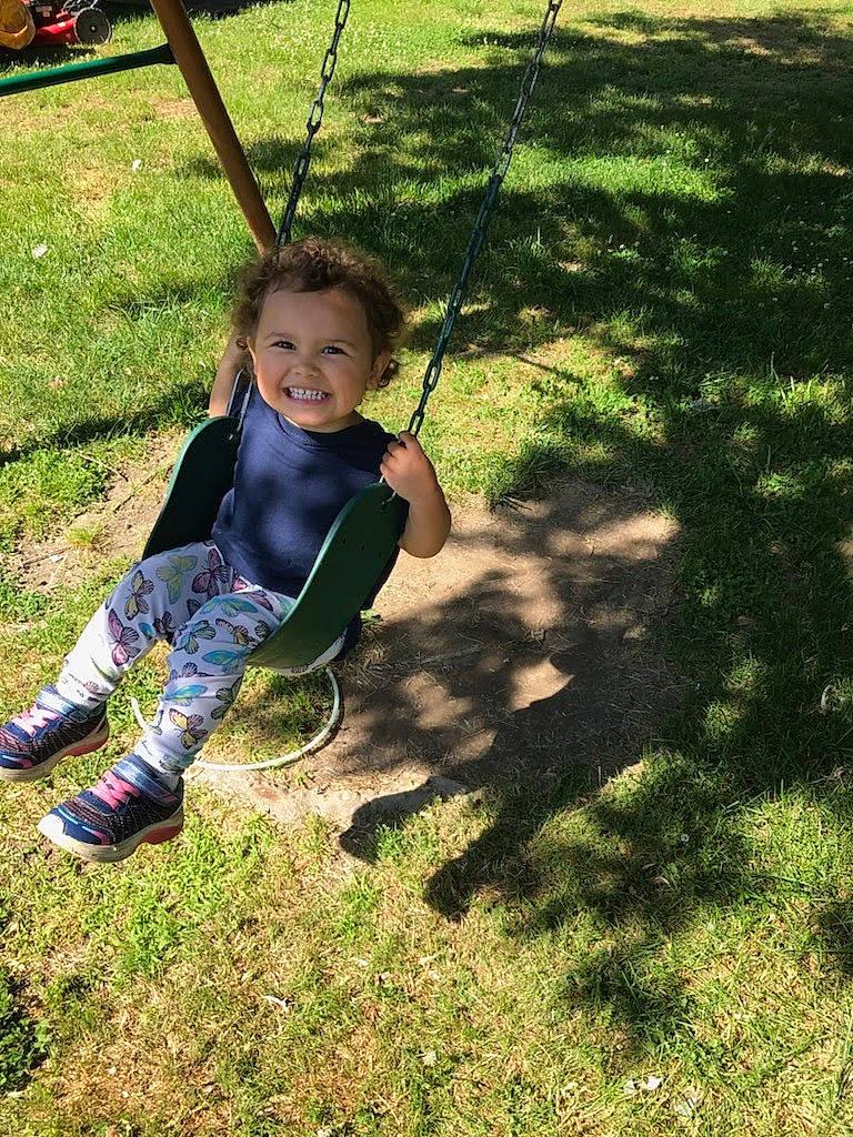 Allison joined the competition — help win amazing prizes! baby, baby_toddler_clothing, boot, child, city, fun, grass, happy, joy, leisure, outdoor_play_equipment, people_in_nature, person, plant, play, playground, recreation, sitting, smile, soil