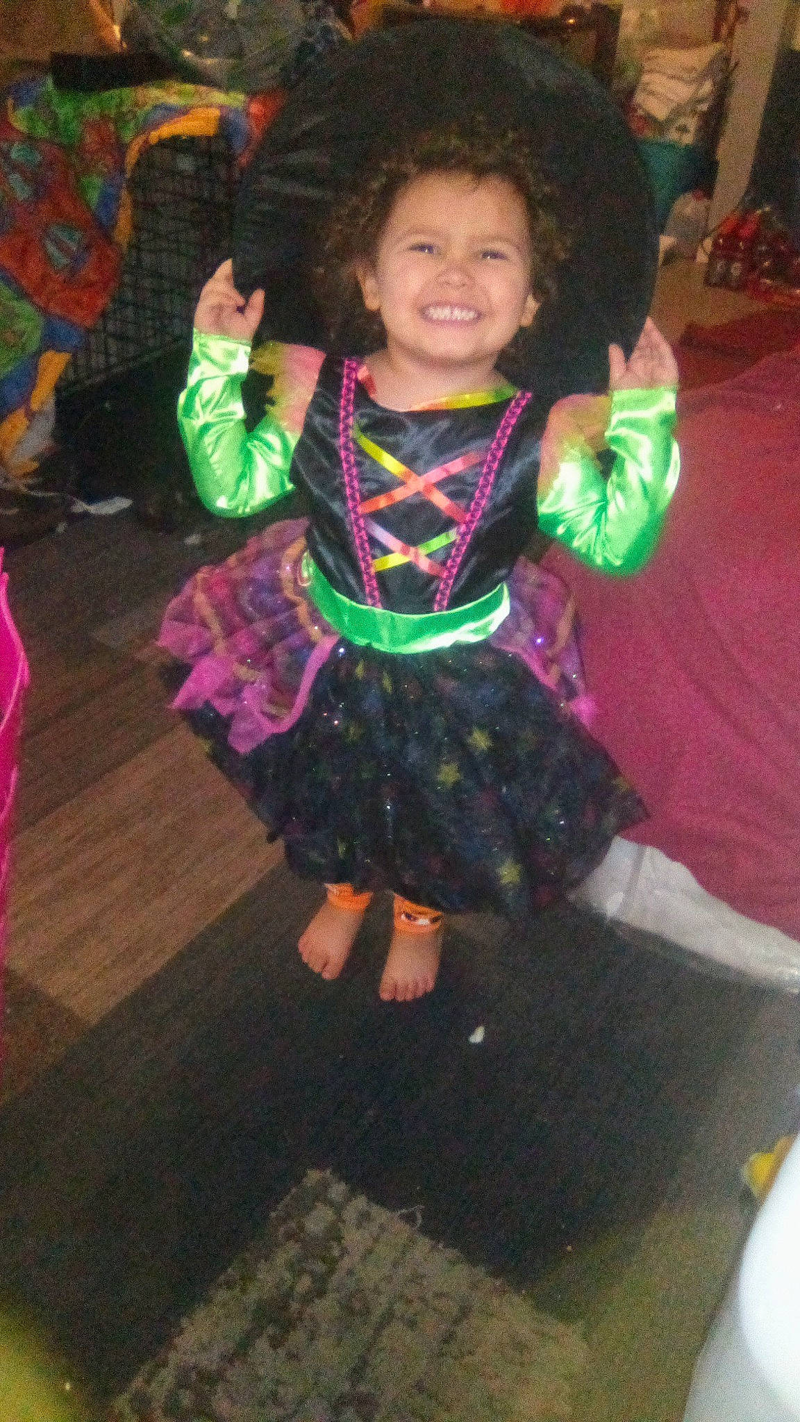 Allison is registered to the contest to win money with this photo: baby_toddler_clothing, child, costume, dress, entertainment, event, fashion_design, fun, happy, holiday, joy, leisure, magenta, party, party_supply, pattern, person, pink, purple, smile