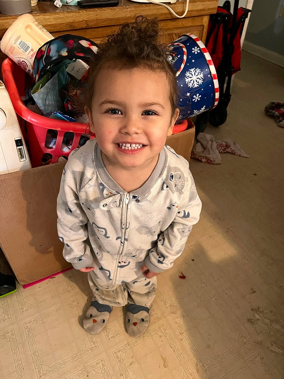 Allison joined the competition — help win amazing prizes! baby, bag, box, carmine, carton, child, floor, flooring, fun, happy, joy, person, shipping_box, sitting, smile, tire, toddler, travel, wheel