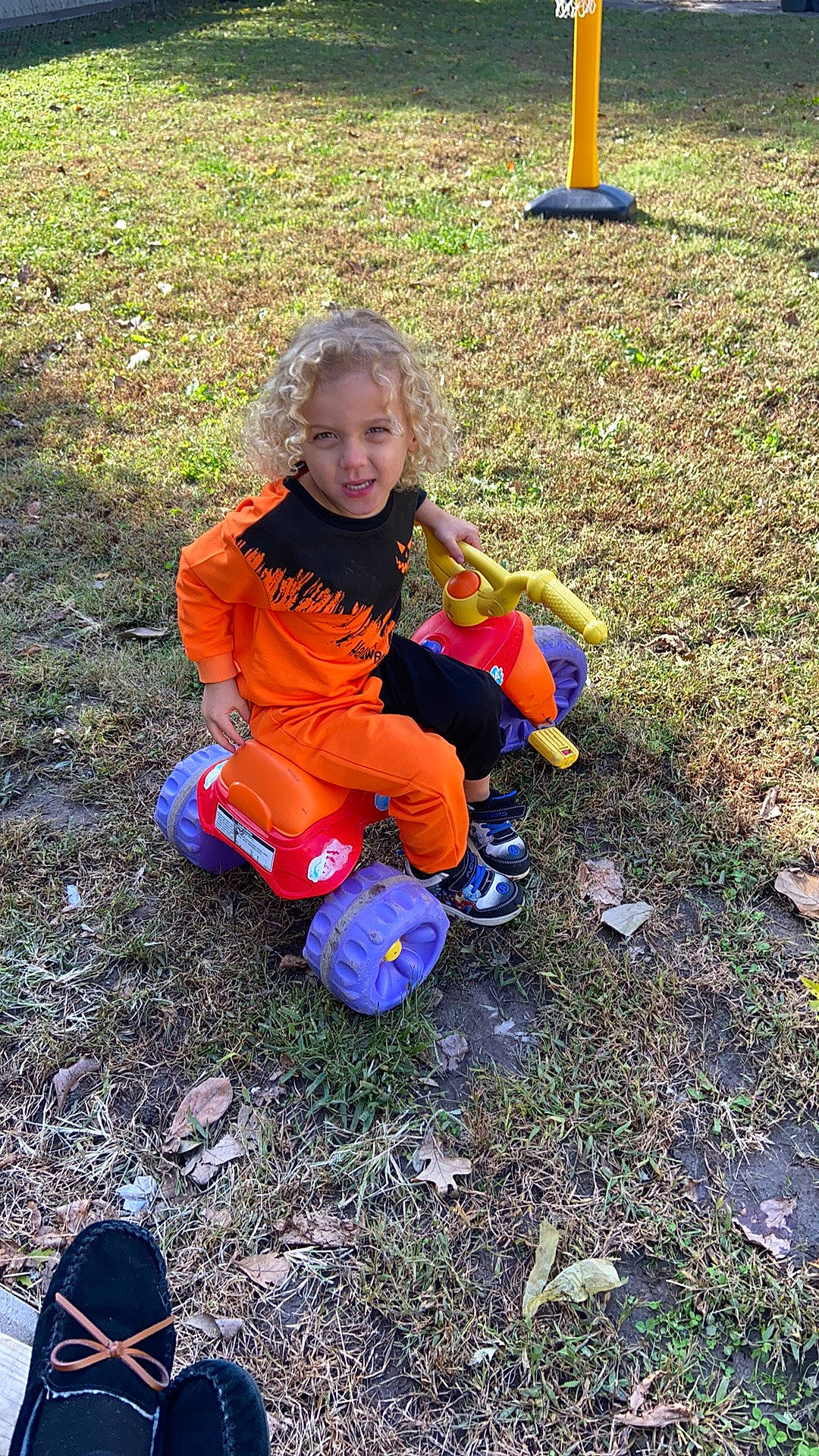 Jesse joined the competition — help win amazing prizes! autumn, baby_toddler_clothing, boot, child, electric_blue, fun, garden, glove, grass, groundcover, leaf, leisure, people_in_nature, person, pumpkin, recreation, sitting, smile, sneakers, soil