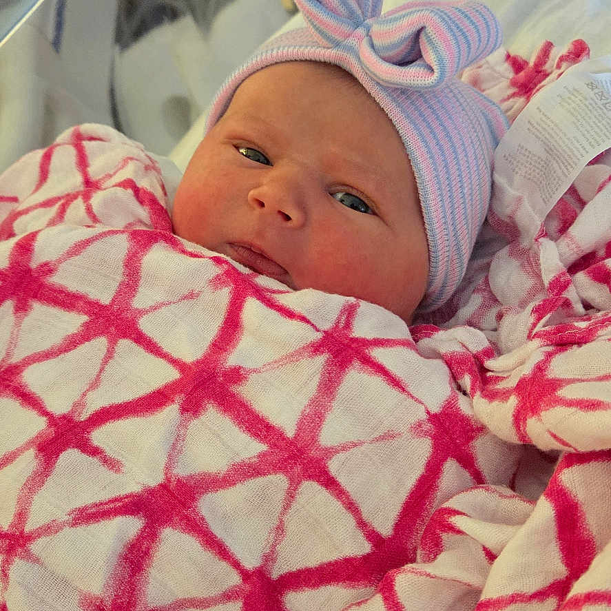 Maddelena joined the competition — help win amazing prizes! architecture, baby, bed, blanket, bonnet, building, clothing, crib, face, furniture, glove, hat, head, hospital, newborn, person, photography, portrait, quilt, sleeping