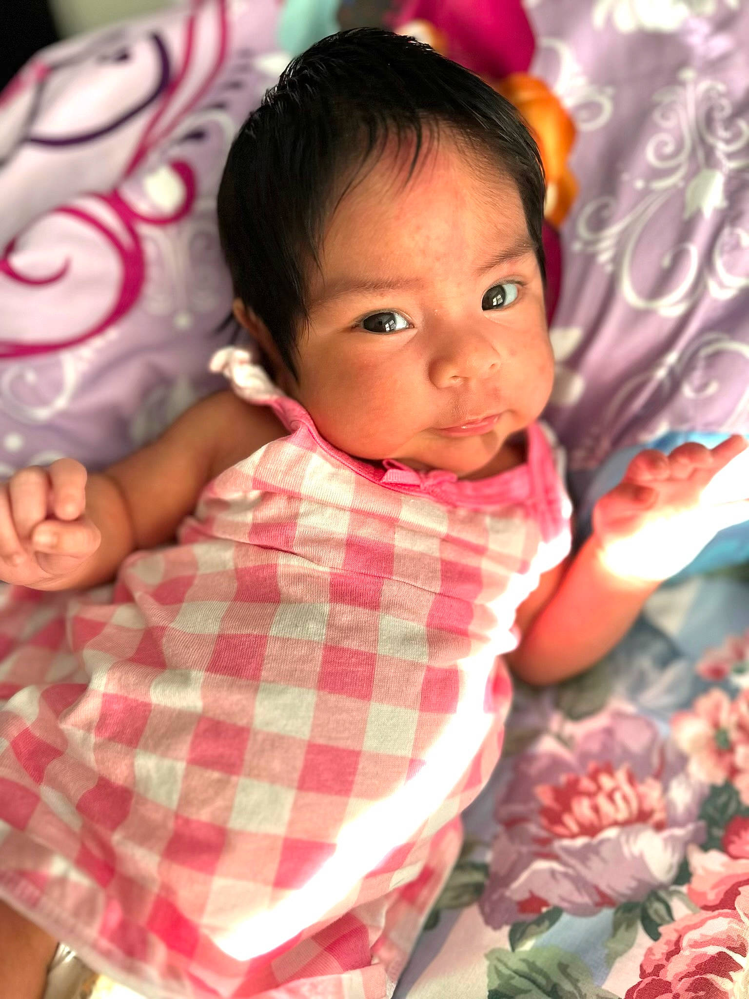 Melissa is registered to the contest to win money with this photo: adaptation, black_hair, cheek, child, eyelash, facial_expression, fun, happy, linens, magenta, mouth, pattern, person, pink, plaid, room, skin, sweetness, tartan, textile