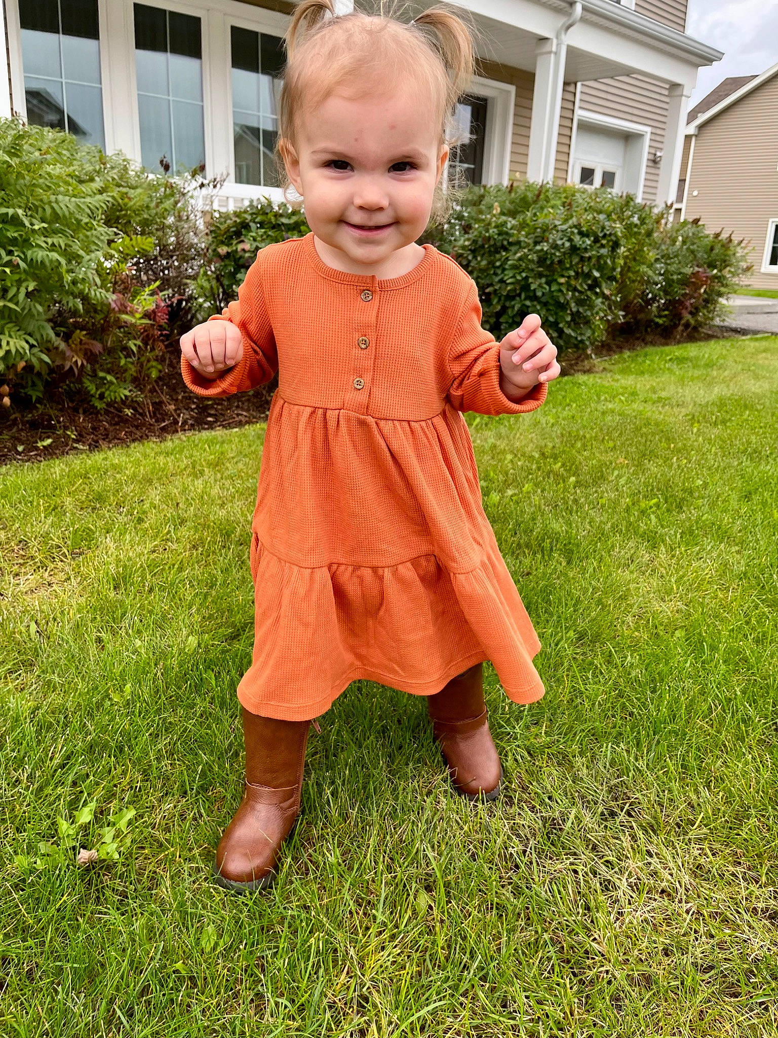 Kinsley joined the competition — help win amazing prizes! baby, baby_toddler_clothing, building, child, dress, gesture, grass, grass_family, groundcover, happy, head, house, human_body, joy, people_in_nature, person, plant, sleeve, smile, thumb
