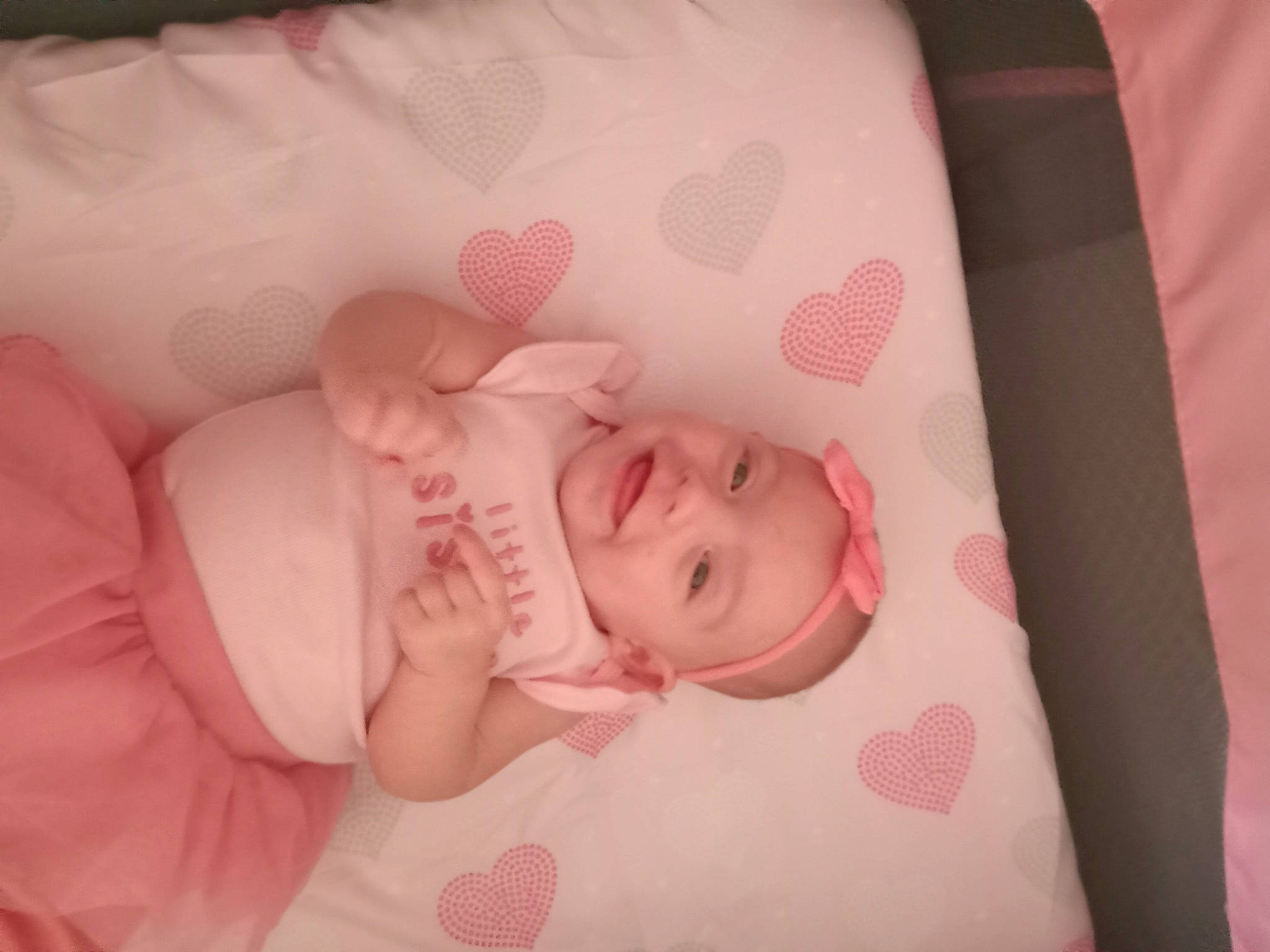 Isabella joined the competition — help win amazing prizes! baby, baby_products, baby_sleeping, baby_toddler_clothing, bedtime, cheek, child, comfort, happy, headwear, joy, linens, magenta, nail, pattern, peach, person, petal, pink, room