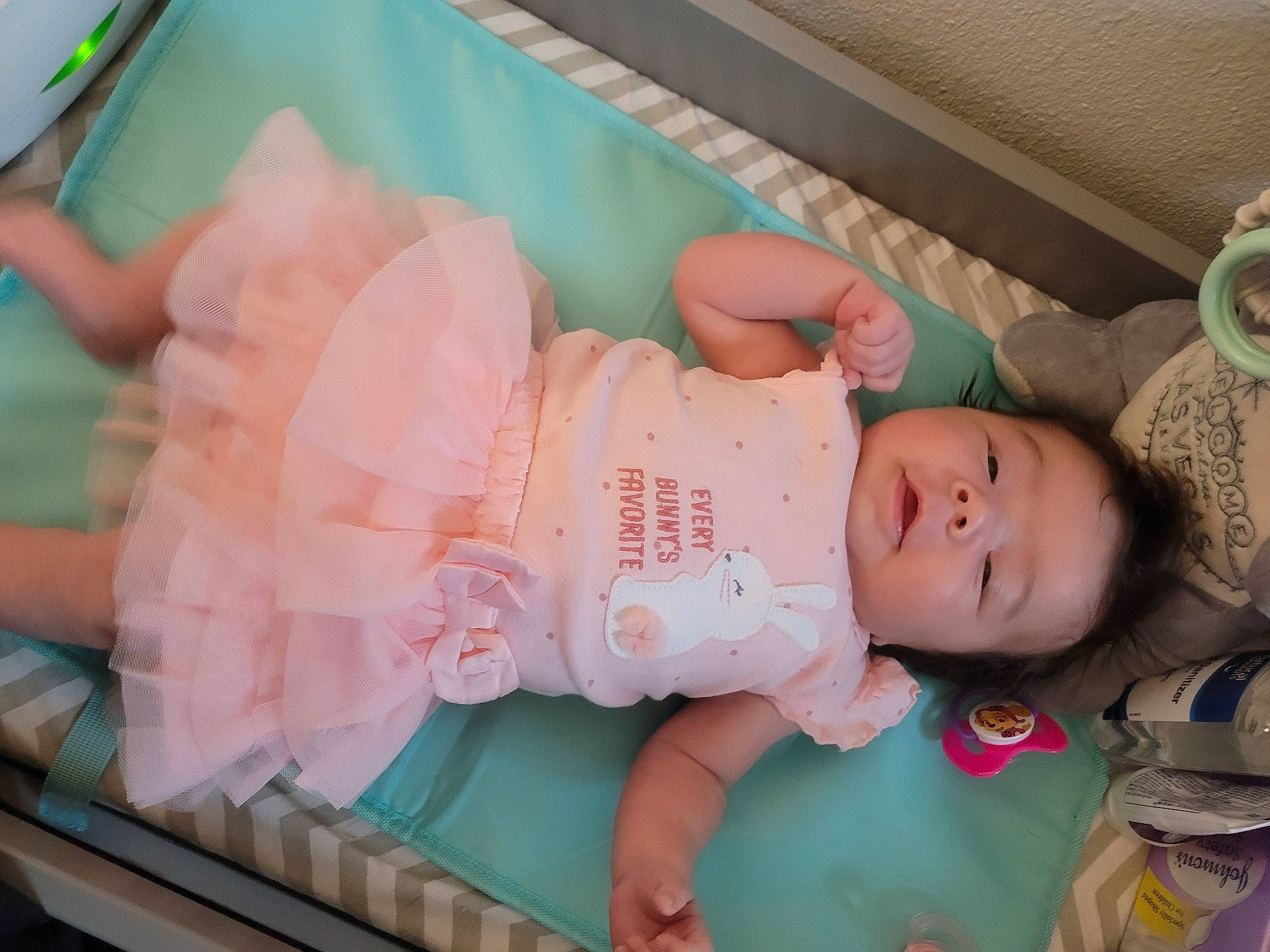 Mara is registered to the contest to win money with this photo: baby, baby_products, baby_safety, baby_toddler_clothing, baby_toys, child, comfort, cradle, infant_bed, linens, pattern, person, pink, product, room, sitting, skin, toddler