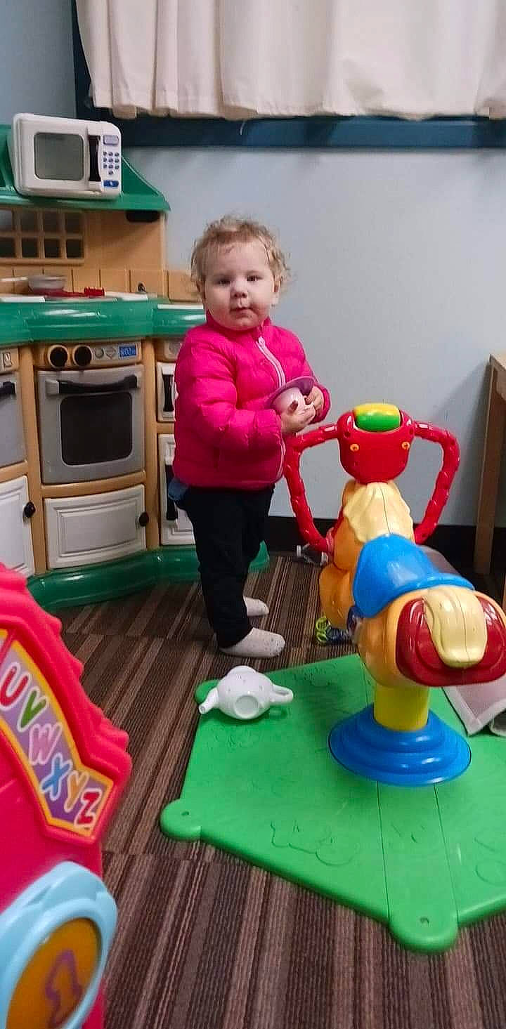 Addilynn joined the competition — help win amazing prizes! animation, baby, baby_products, baby_toys, child, flooring, fun, home_appliance, kindergarten, kitchen_appliance, microwave_oven, person, plastic, play, room, sitting, standing, stuffed_toy, television, toddler