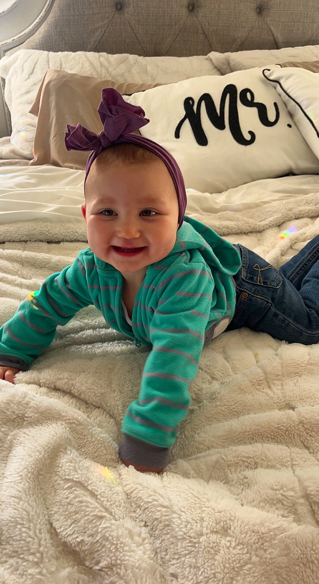 Haley joined the competition — help win amazing prizes! baby, baby_toddler_clothing, bedding, child, comfort, face, flooring, font, fur, grass, happy, joy, linens, pattern, person, pillow, sitting, skin, sleeve, smile