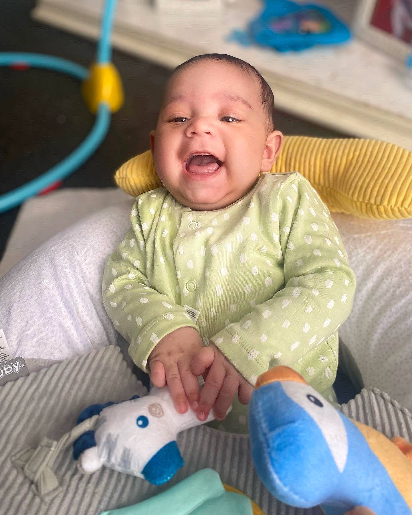 Zak is registered to the contest to win money with this photo: baby, baby_toddler_clothing, blue, cheek, comfort, eye, finger, happy, head, iris, mammal, mouth, nose, organ, person, photograph, product, skin, smile, textile