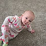 Macie Rae joined the competition — help win amazing prizes! baby, child, pajamas, heart_pattern, carpet, floor, crawling, infant, cute, indoor, person, toddler, head_tilt, sleepwear, green_socks, expression, skin, hand, footwear, room