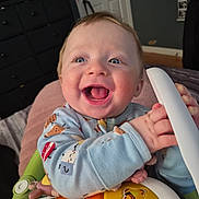 Robert is registered to the contest to win money with this photo: baby, child, smiling, happy, indoor, toy, piano, colorful, face, hands, clothing, blue_eyes, furniture, room, play, cute, infant, joy, expression, person