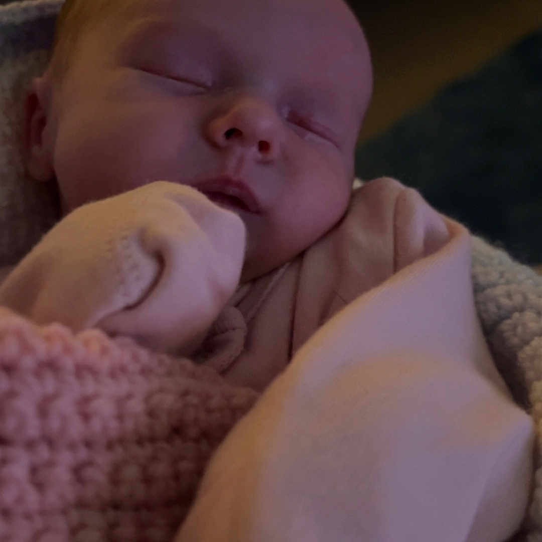 Winter-Leigh is registered to the contest to win money with this photo: baby, blanket, child, closed_eyes, clothing, cozy, cute, face, hand, human, indoors, infant, newborn, peaceful, pink, portrait, resting, sleeping, soft, warm