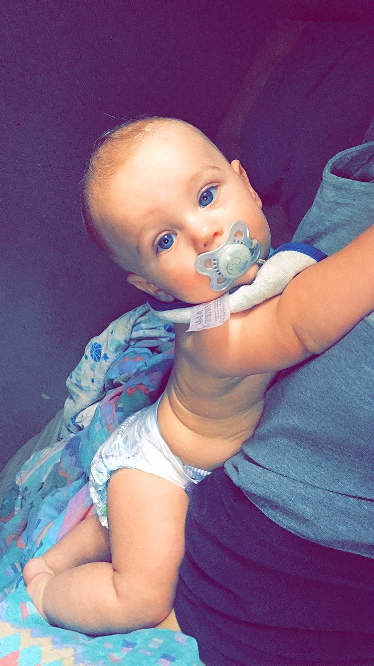 Zayden is registered to the contest to win money with this photo: arm, azure, baby_toddler_clothing, cheek, ear, eye, eyelash, finger, gesture, hand, happy, iris, joint, lip, mouth, neck, nose, person, shoulder, skin