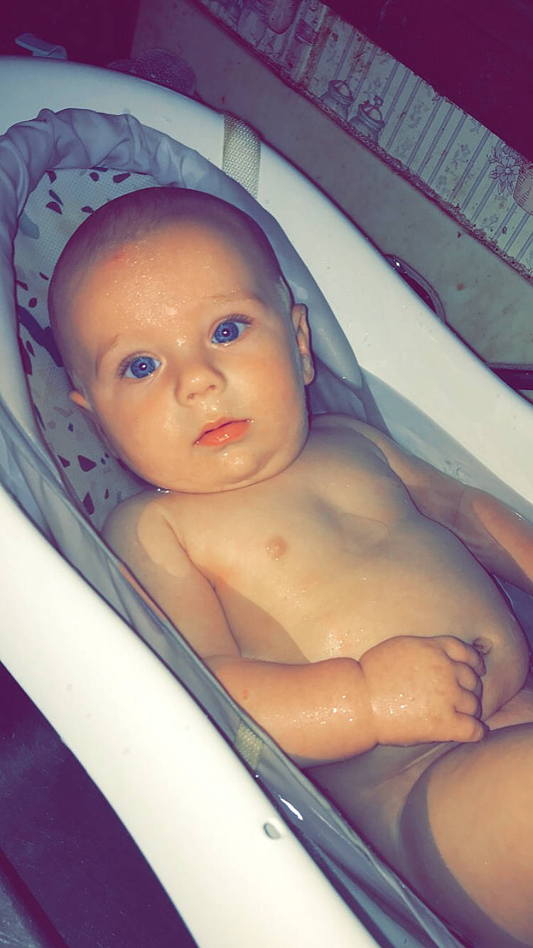 Zayden is registered to the contest to win money with this photo: baby, bathing, cheek, chest, chin, eye, eyebrow, eyelash, face, finger, forehead, hair, hairstyle, head, human_body, iris, lip, mouth, nose, person