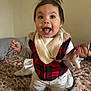 Adina joined the competition — help win amazing prizes! toddler, child, smiling, happy, indoor, bed, blanket, clothing, vest, pajamas, person, face, hair, pacifier, toy, hand, bedroom, cute, playful, expression