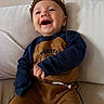 Julian joined the competition — help win amazing prizes! baby, child, infant, smiling, happy, portrait, indoors, sofa, cushion, seated, crocheted_hat, crown, blue_sleeves, brown_outfit, clothing, face, open_mouth, laughing, home, photography