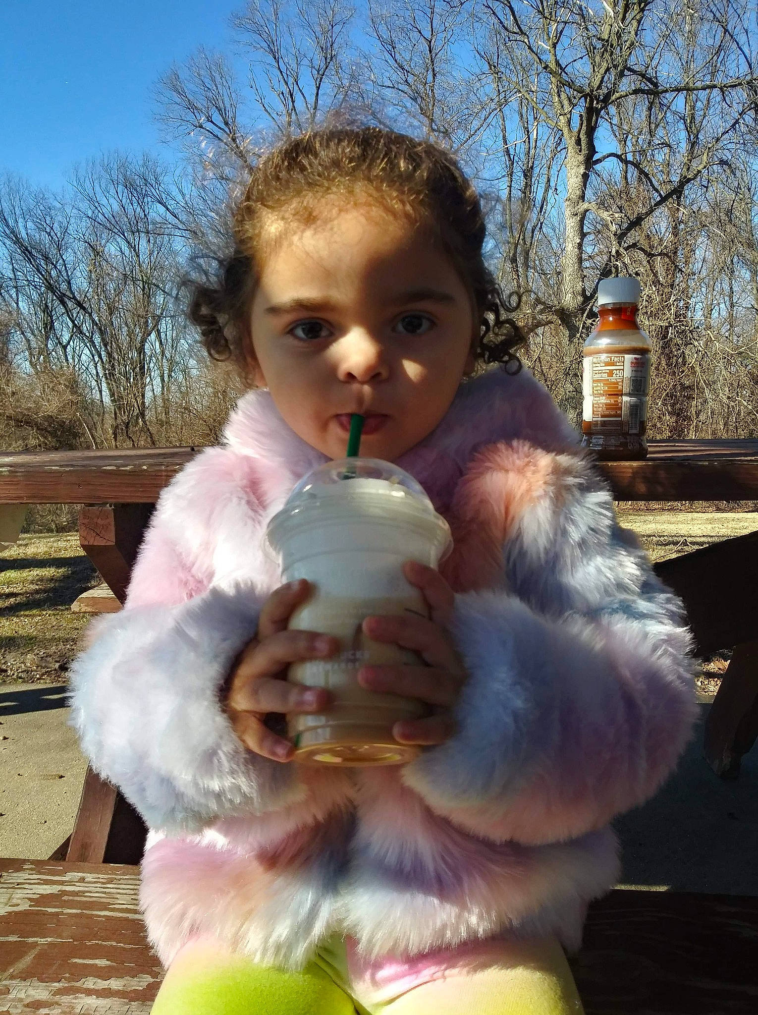 Meyah is registered to the contest to win money with this photo: baby, child, fun, fur, grass, happy, leaf, people_in_nature, person, plant, sitting, sky, stuffed_toy, teddy_bear, toddler, toy, tree, vacation, winter