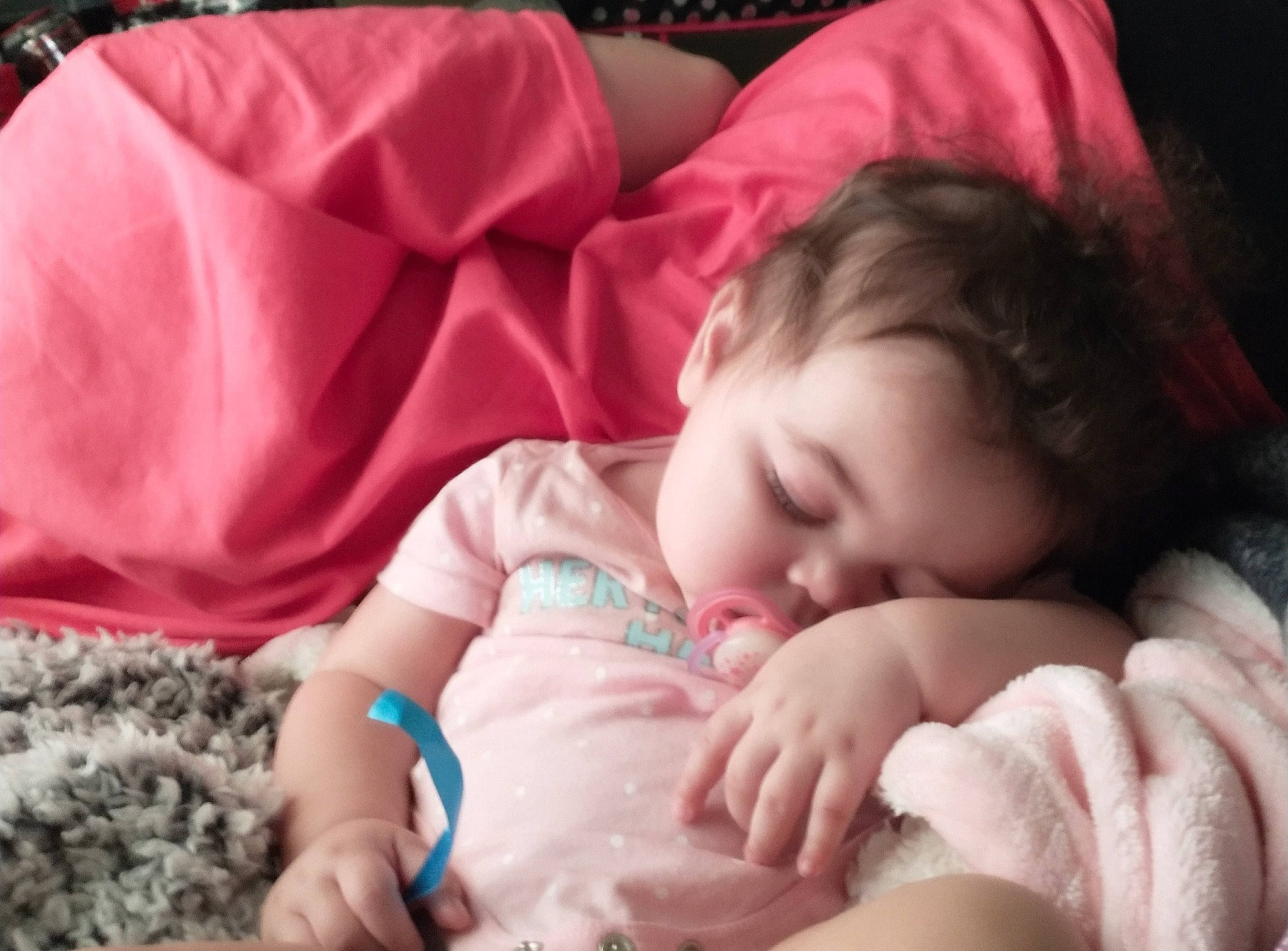 Maleah is registered to the contest to win money with this photo: baby, baby_toddler_clothing, cheek, comfort, eye, eyebrow, finger, grass, hair, hand, happy, iris, lip, mammal, mouth, nose, person, pink, skin, textile