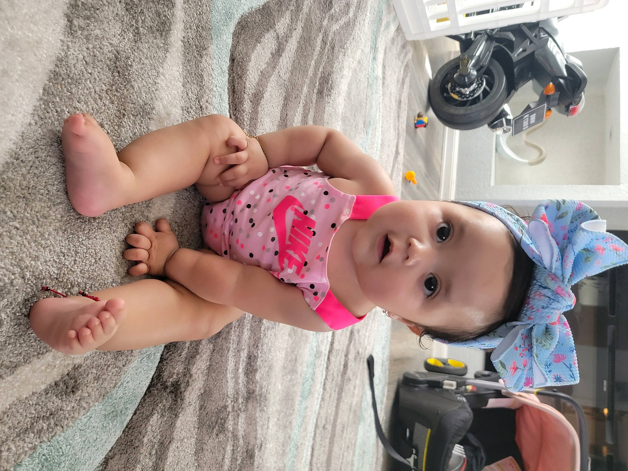 Sophia Aitana Reyes is registered to the contest to win money with this photo: abdomen, arm, baby, baby_products, baby_toddler_clothing, child, comfort, eyewear, foot, fun, glasses, human_leg, joint, knee, person, shorts, sitting, skin, sock, thigh