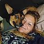 Jaxson is registered to the contest to win money with this photo: dog, person, smile, face, lying_down, snuggle, affection, indoor, clothing, sunglasses, pet, closeup, happy, portrait, canine, animal, warmth, companion, resting, casual